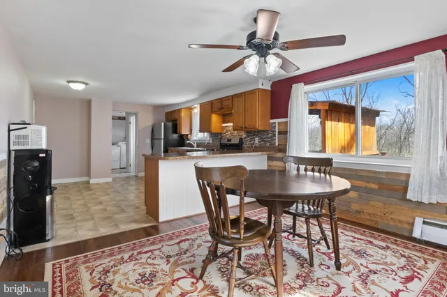 a dining room with furniture and window