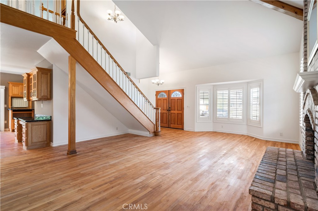 5306 Halison Street Torrance, CA 90503 - Photo 7 of 38 a view of an empty room with wooden floor and stairs