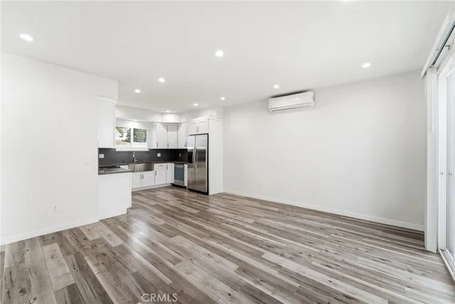 a view of kitchen cabinet and microwave
