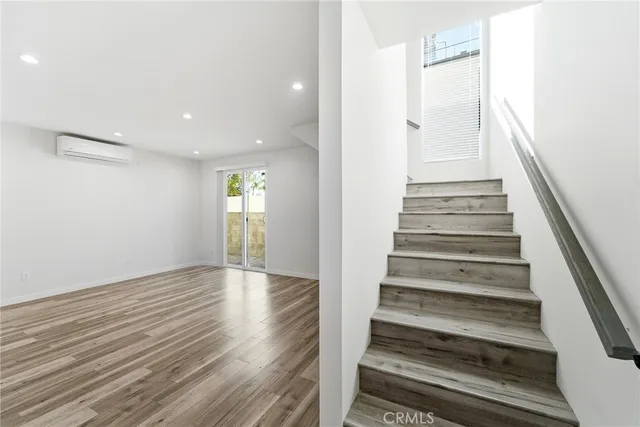 a view of an entryway with wooden floor