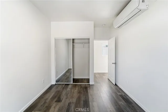 a view of hallway with wooden floor