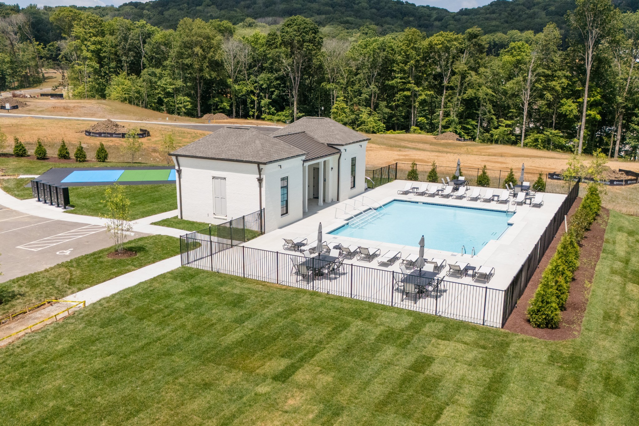9407 Dewaal Ridge Brentwood, TN 37027 - Photo 7 of 8 a view of a house with pool and chairs