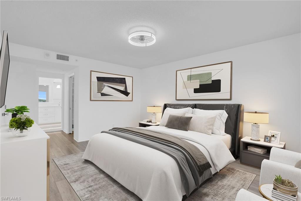 1925 Clifford Street, Unit 1102 Fort Myers, FL 33901 - Photo 18 of 50 a bedroom with bed and a couch