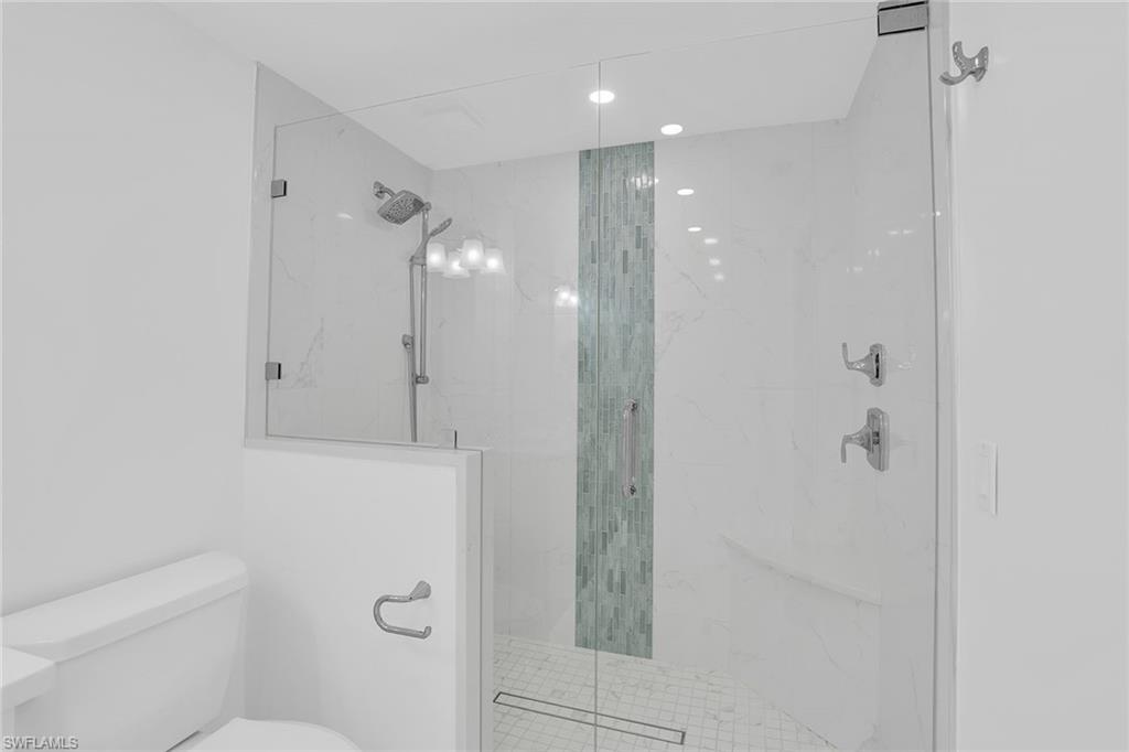 1925 Clifford Street, Unit 1102 Fort Myers, FL 33901 - Photo 23 of 50 a bathroom with a shower a toilet and sink