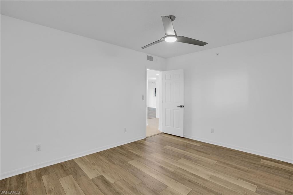 1925 Clifford Street, Unit 1102 Fort Myers, FL 33901 - Photo 25 of 50 wooden floor in an empty room