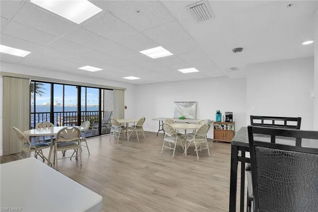 a living room with furniture and a book shelf