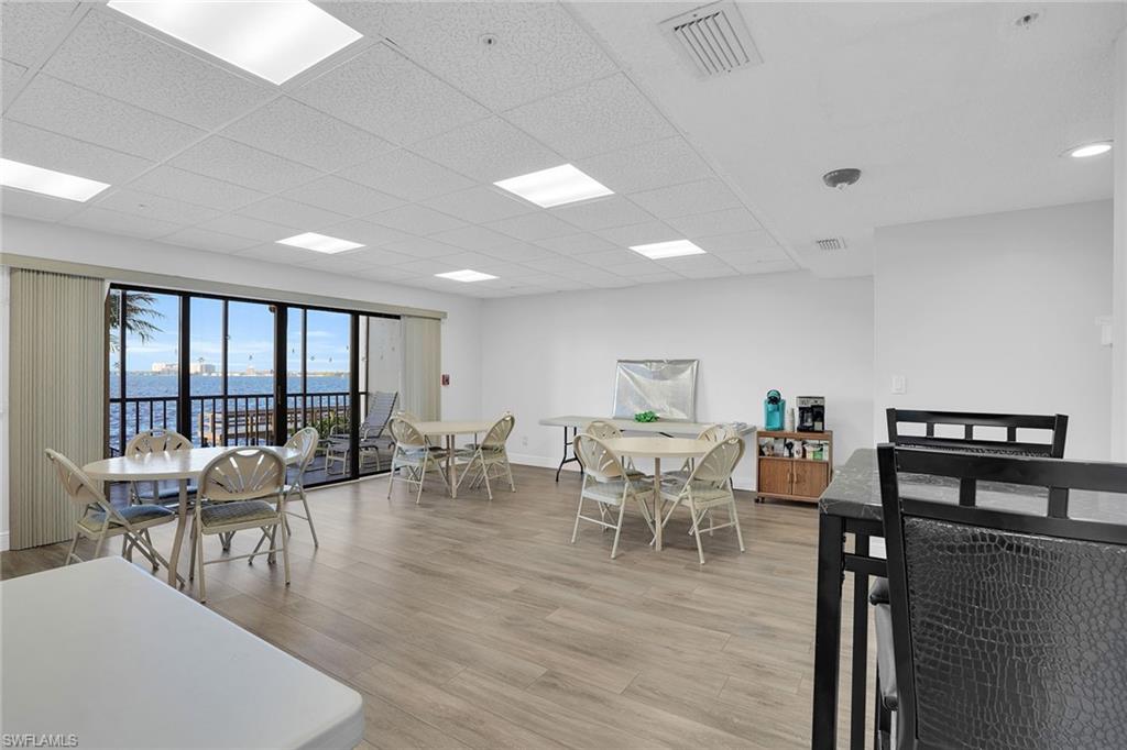 1925 Clifford Street, Unit 1102 Fort Myers, FL 33901 - Photo 43 of 50 a view of a dining room with furniture window and wooden floor