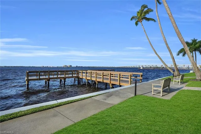 a view of a roof deck with wooden floor and fence