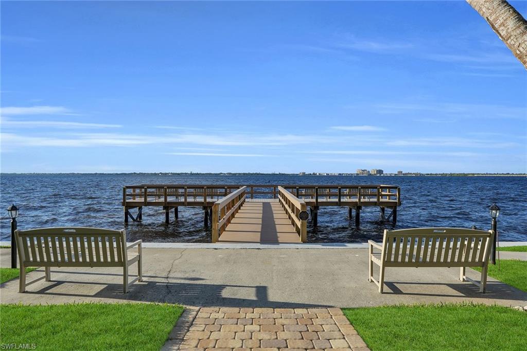 1925 Clifford Street, Unit 1102 Fort Myers, FL 33901 - Photo 47 of 50 a view of a roof deck with wooden floor and fence