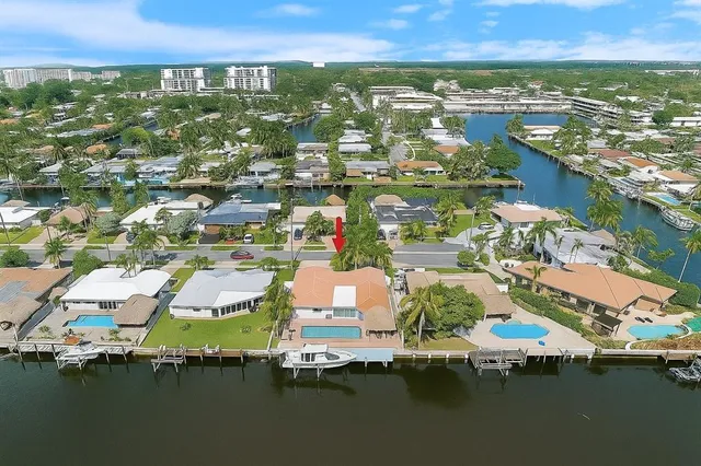 an aerial view of residential houses with outdoor space