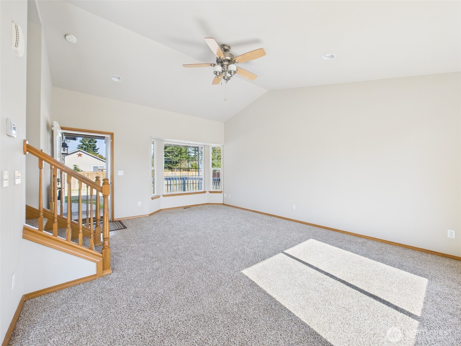 7143 196th Avenue Southwest Rochester, WA 98579 - Photo 8 of 34 an empty room with windows and fan