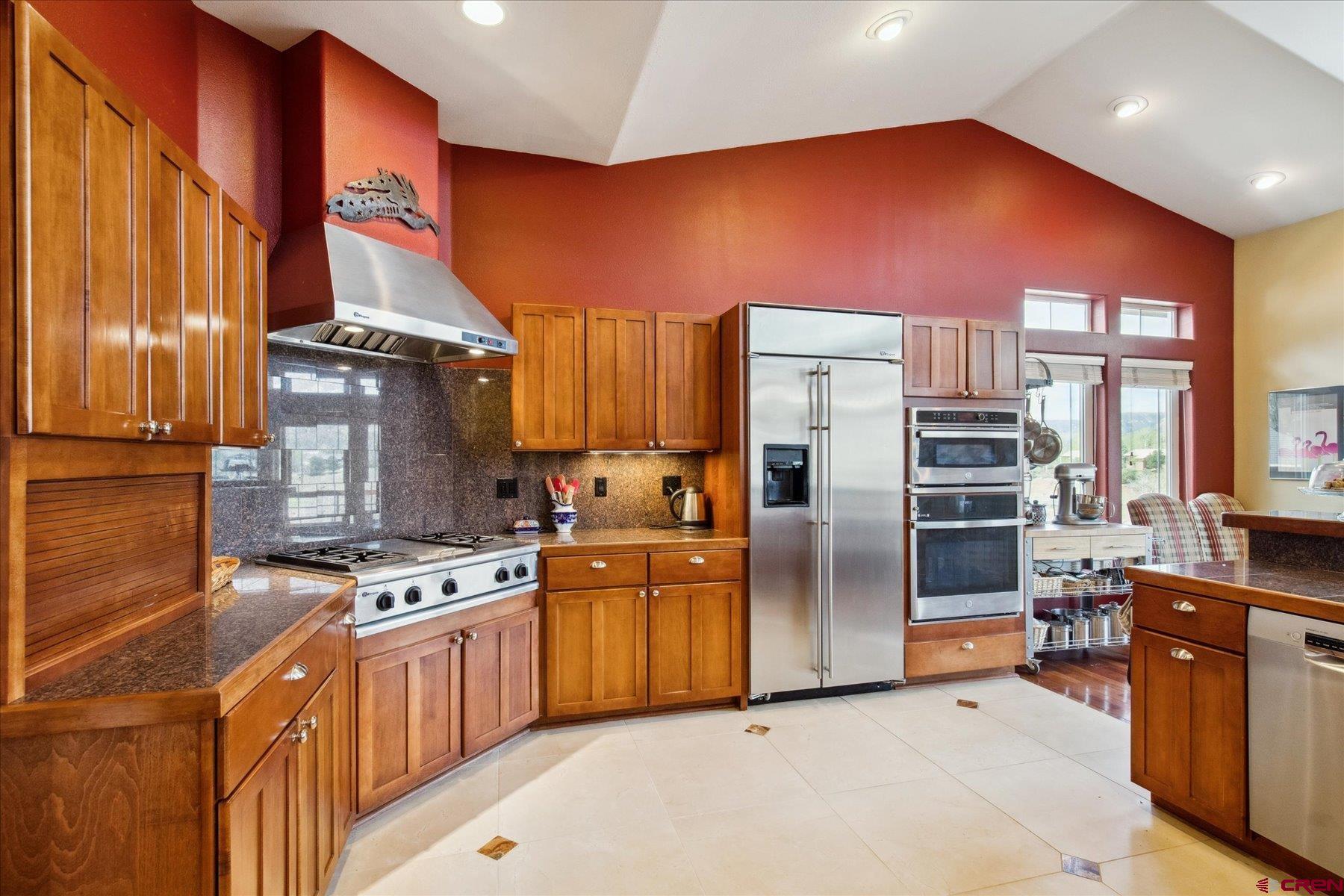 39 Ophir Drive Durango, CO 81301 - Photo 11 of 44 a kitchen with stainless steel appliances granite countertop a stove refrigerator sink and cabinets
