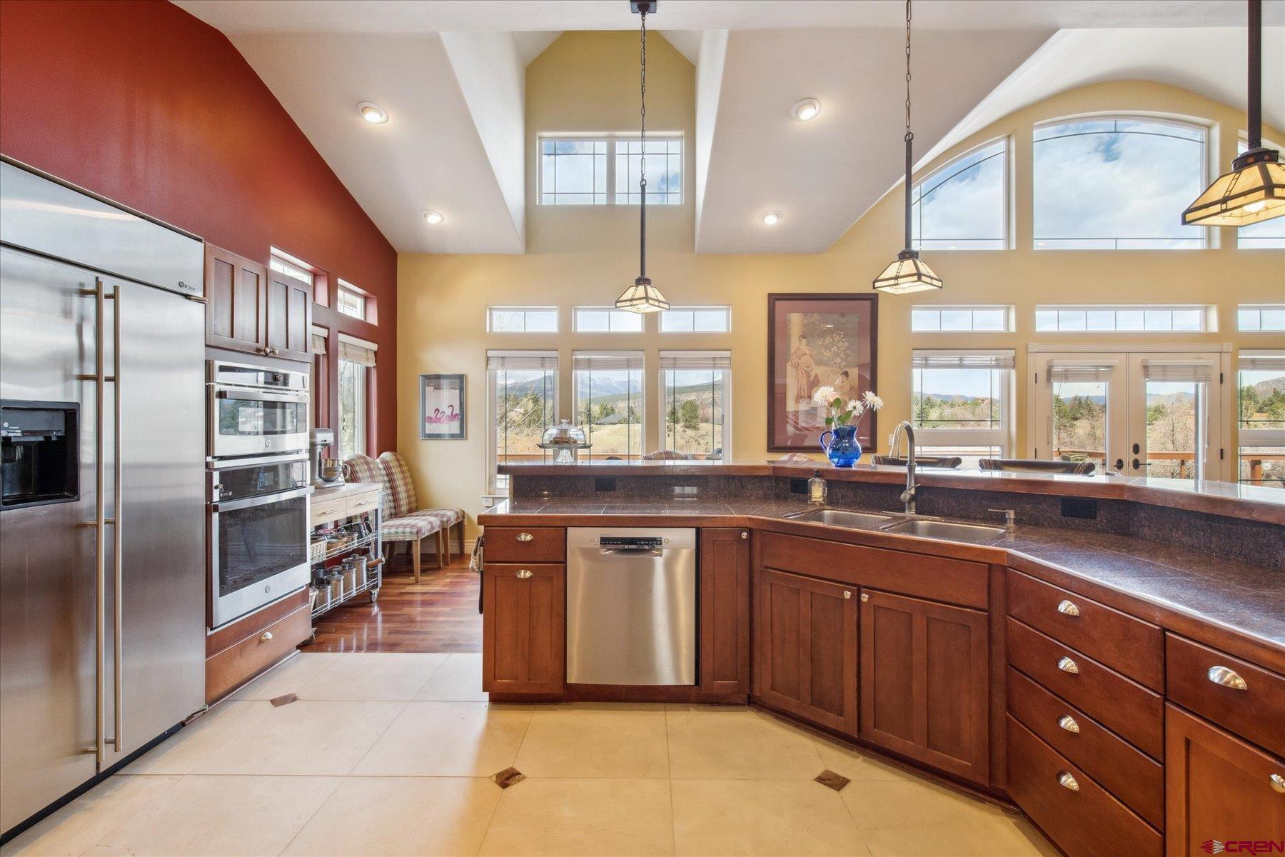 39 Ophir Drive Durango, CO 81301 - Photo 12 of 44 a large kitchen with a large counter top a sink stainless steel appliances and cabinets