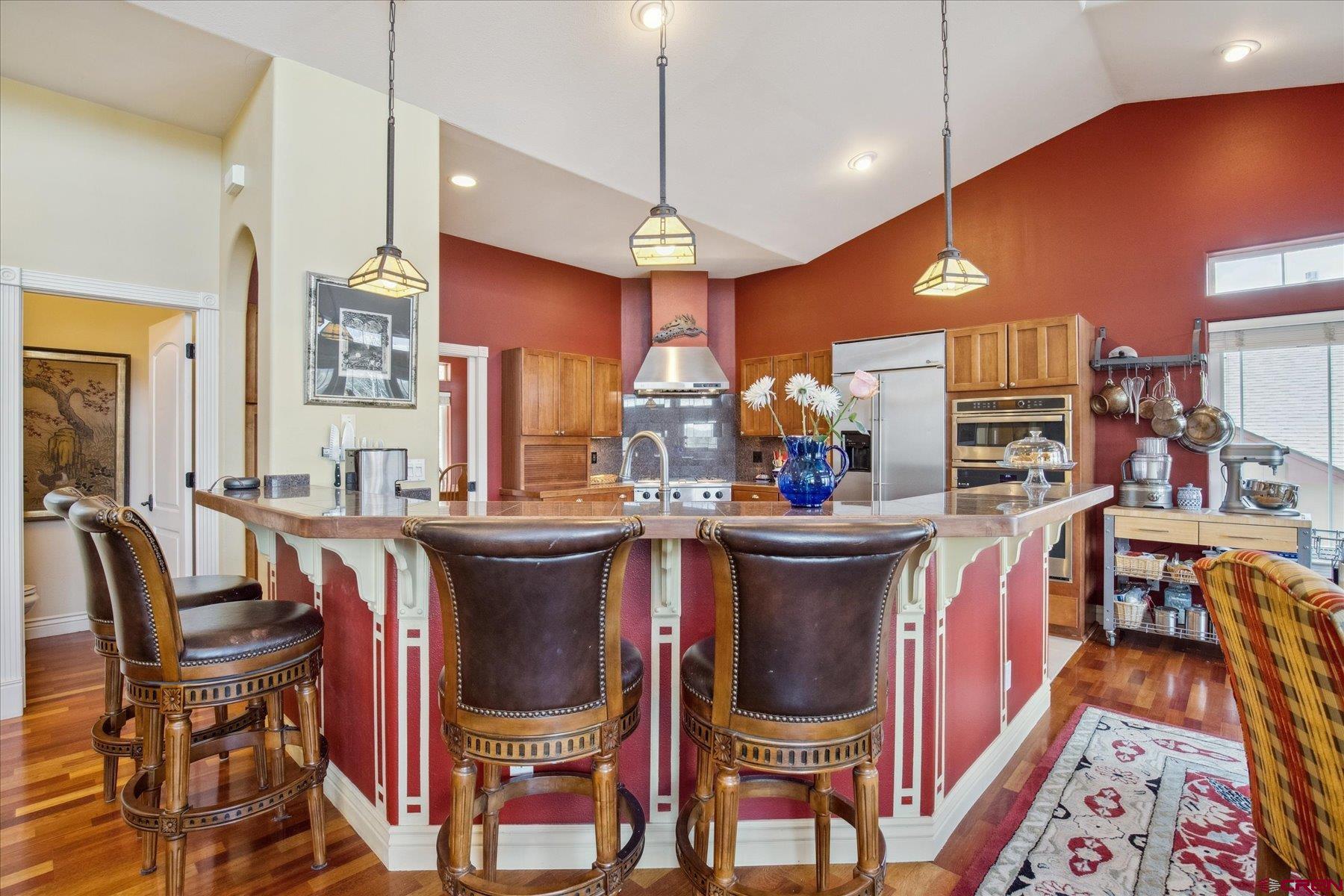 39 Ophir Drive Durango, CO 81301 - Photo 13 of 44 a large kitchen with a table and chairs