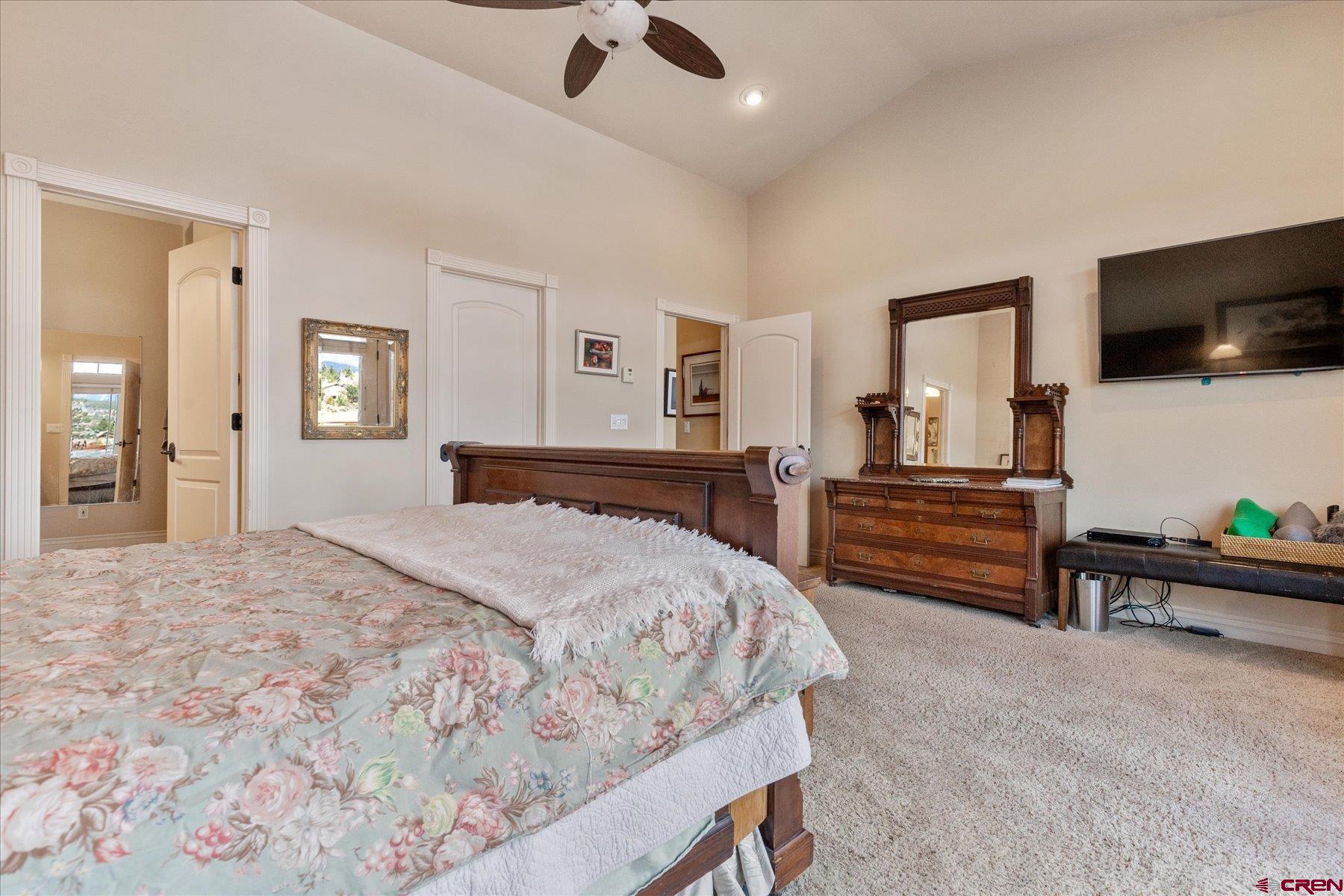 39 Ophir Drive Durango, CO 81301 - Photo 18 of 44 a bedroom with a bed and flat screen tv