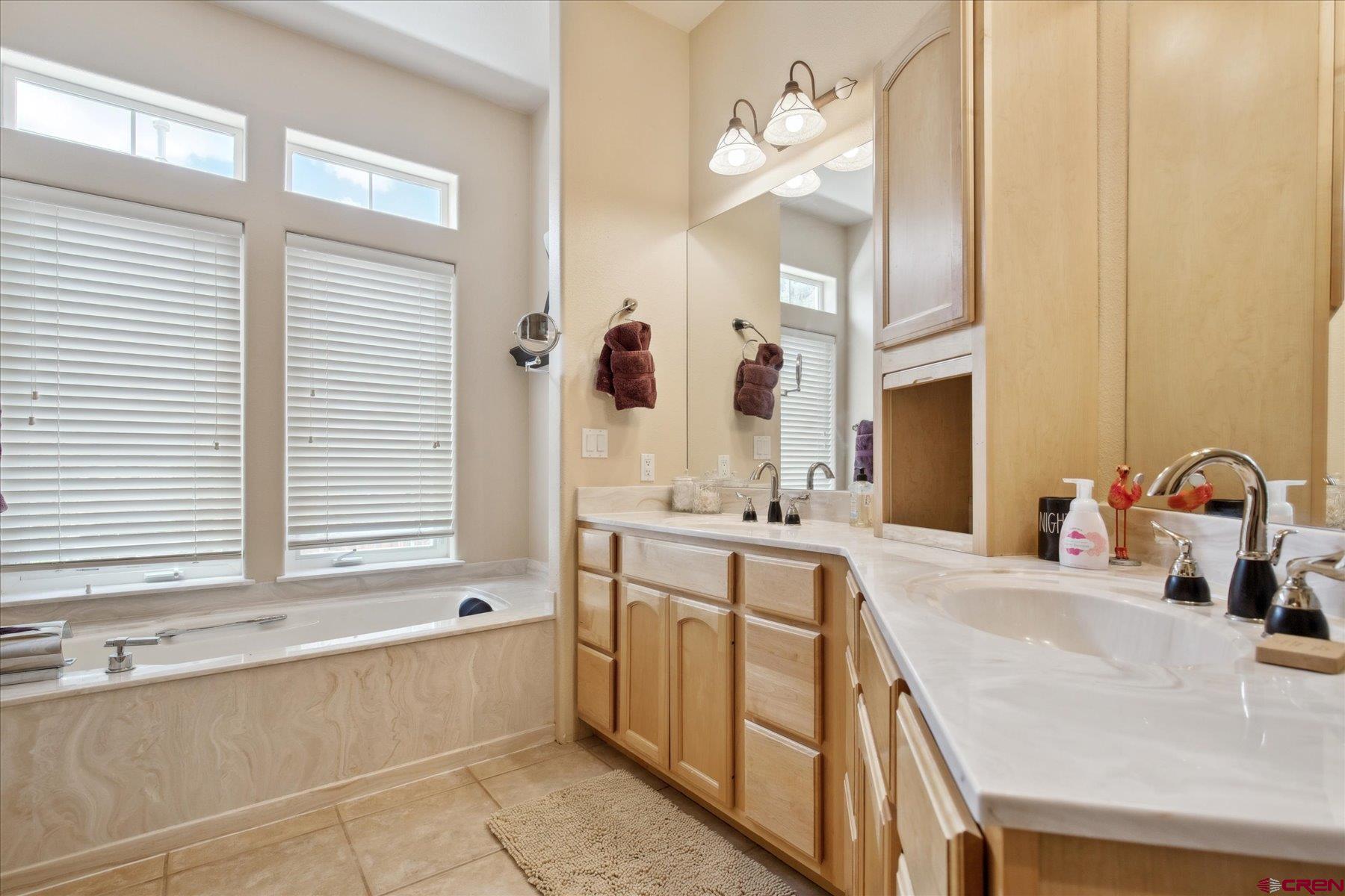 39 Ophir Drive Durango, CO 81301 - Photo 28 of 44 a bathroom with a tub sink and mirror