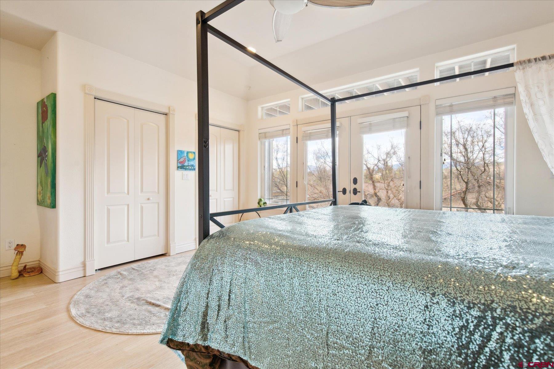 39 Ophir Drive Durango, CO 81301 - Photo 32 of 44 a view of a bedroom with wooden floor and windows