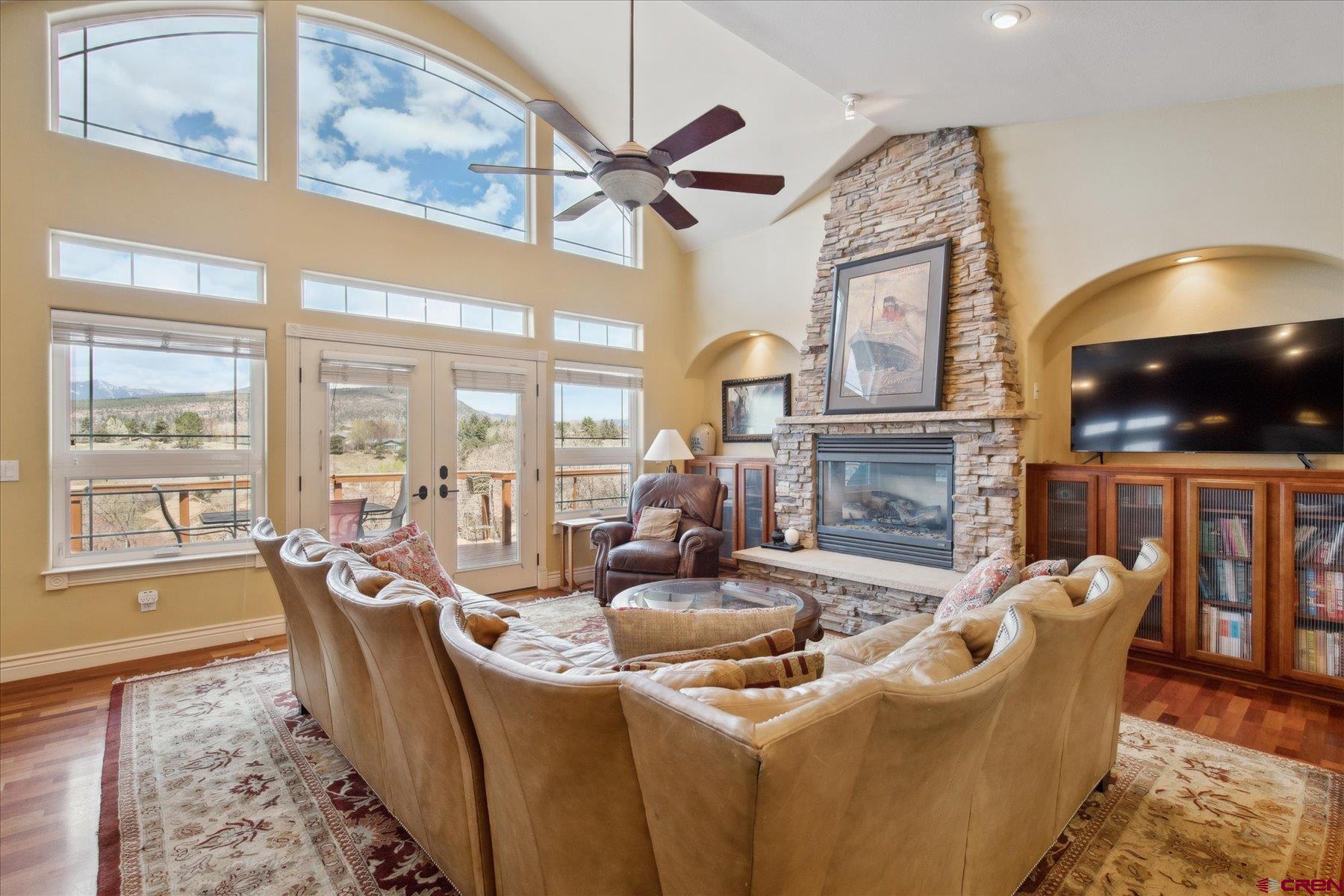 39 Ophir Drive Durango, CO 81301 - Photo 5 of 44 a living room with fireplace furniture and a large window