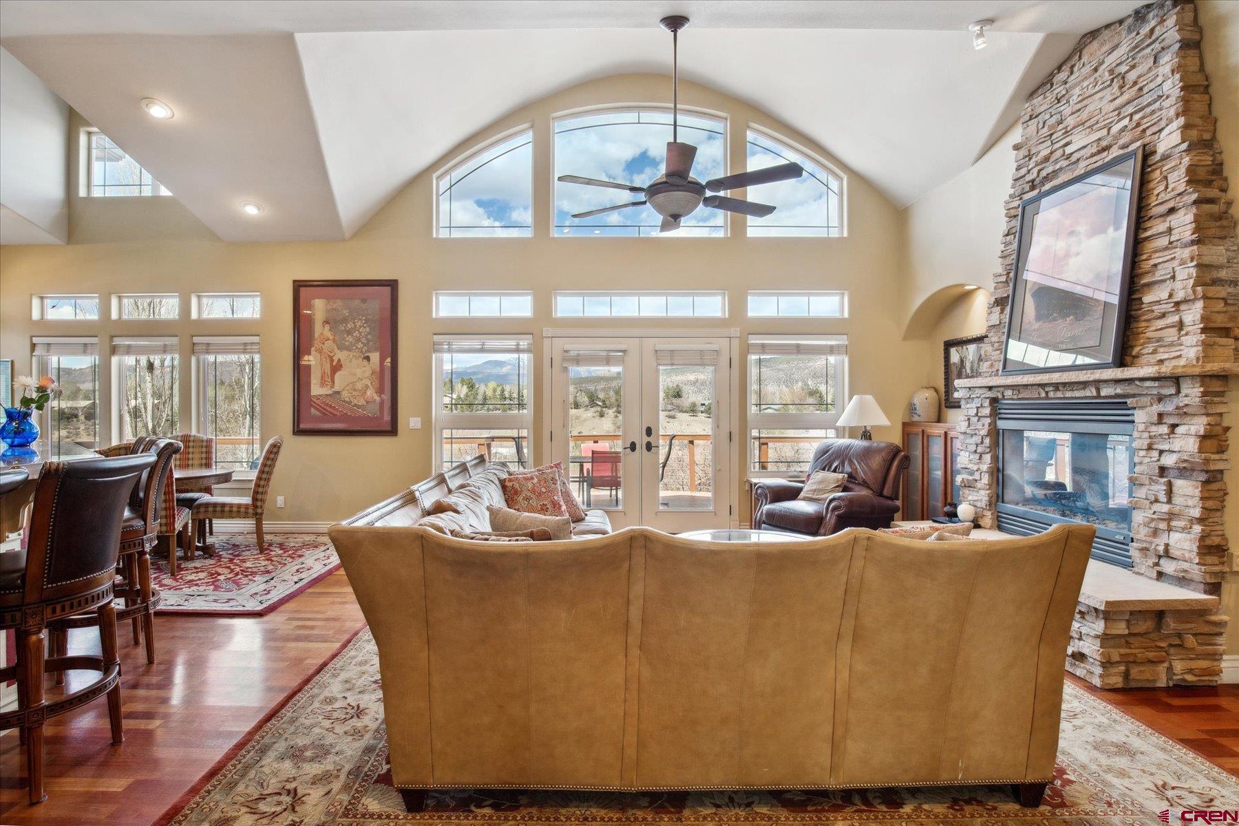 39 Ophir Drive Durango, CO 81301 - Photo 6 of 44 a living room with fireplace furniture and a chandelier