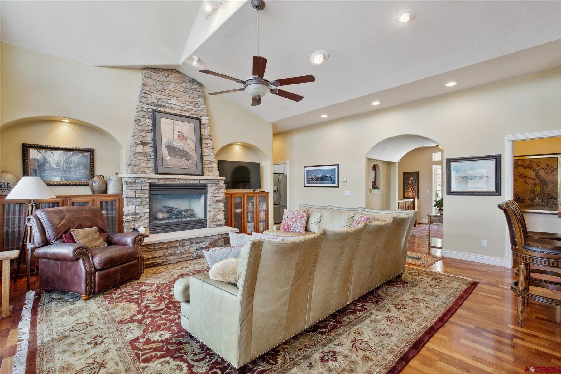 39 Ophir Drive Durango, CO 81301 - Photo 7 of 44 a living room with furniture a fireplace and a flat screen tv