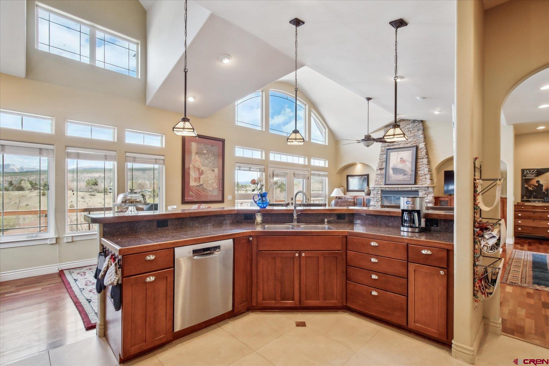 39 Ophir Drive Durango, CO 81301 - Photo 10 of 44 a kitchen with a sink and wooden cabinets