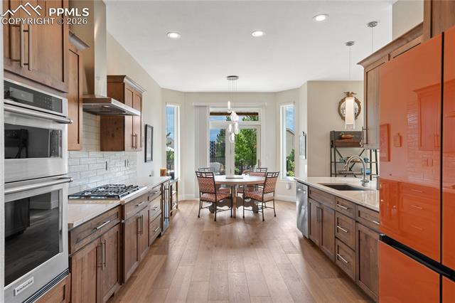 15110 Ridgefield Lane Colorado Springs, CO 80921 - Photo 11 of 50 Hardwood floor in kitchen