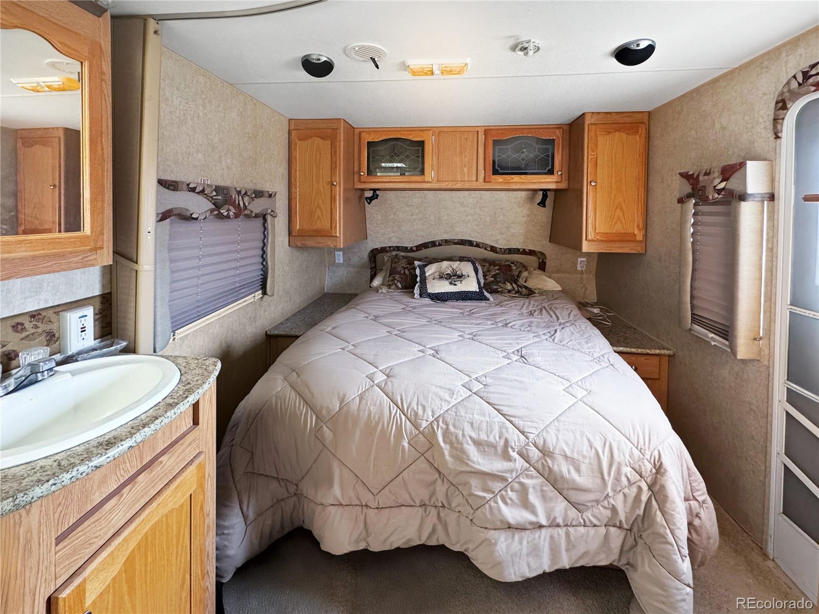 1525 L Path Cotopaxi, CO 81223 - Photo 11 of 28 a bedroom with a bed and a mirror