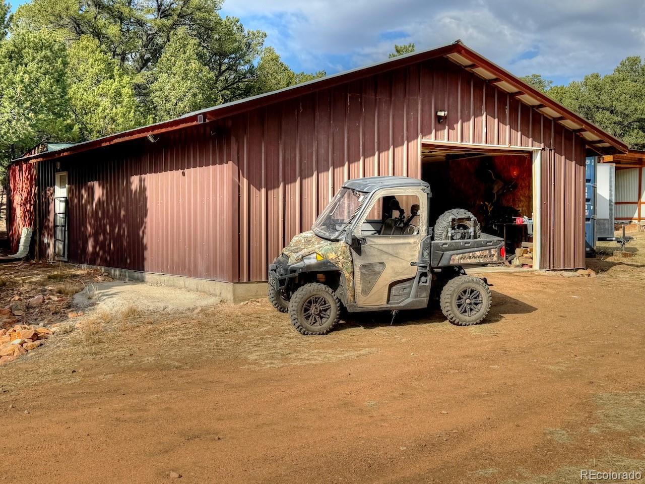 1525 L Path Cotopaxi, CO 81223 - Photo 17 of 28 a view of a house with a patio and a yard