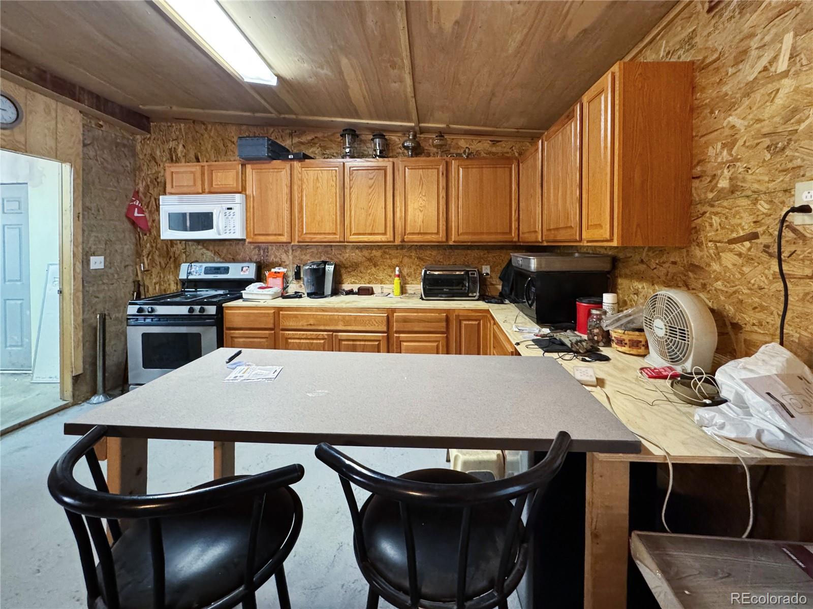 1525 L Path Cotopaxi, CO 81223 - Photo 24 of 28 a kitchen with a dining table and chairs