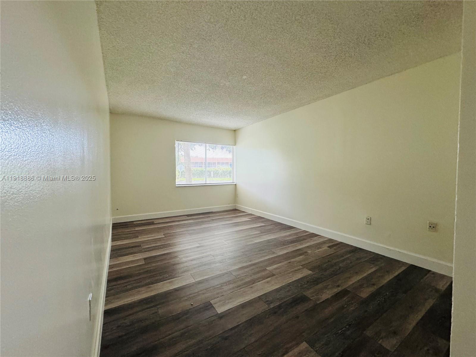 701 North Pine Island Road, Unit 101 Plantation, FL 33324 - Photo 23 of 31 a view of an empty room and window