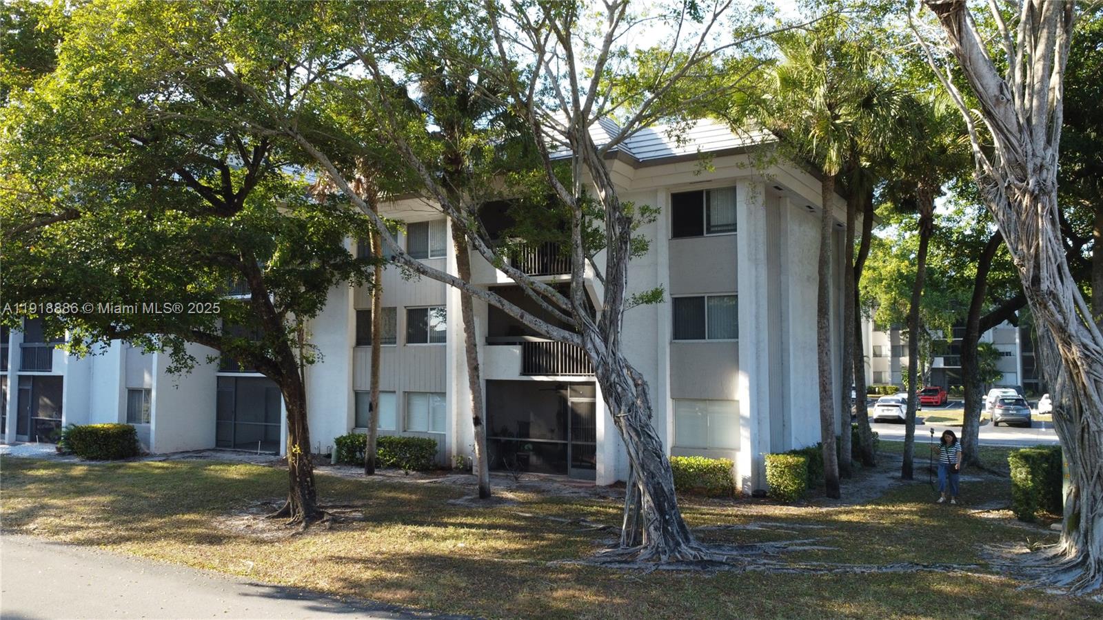 701 North Pine Island Road, Unit 101 Plantation, FL 33324 - Photo 26 of 31 a front view of a house with a yard