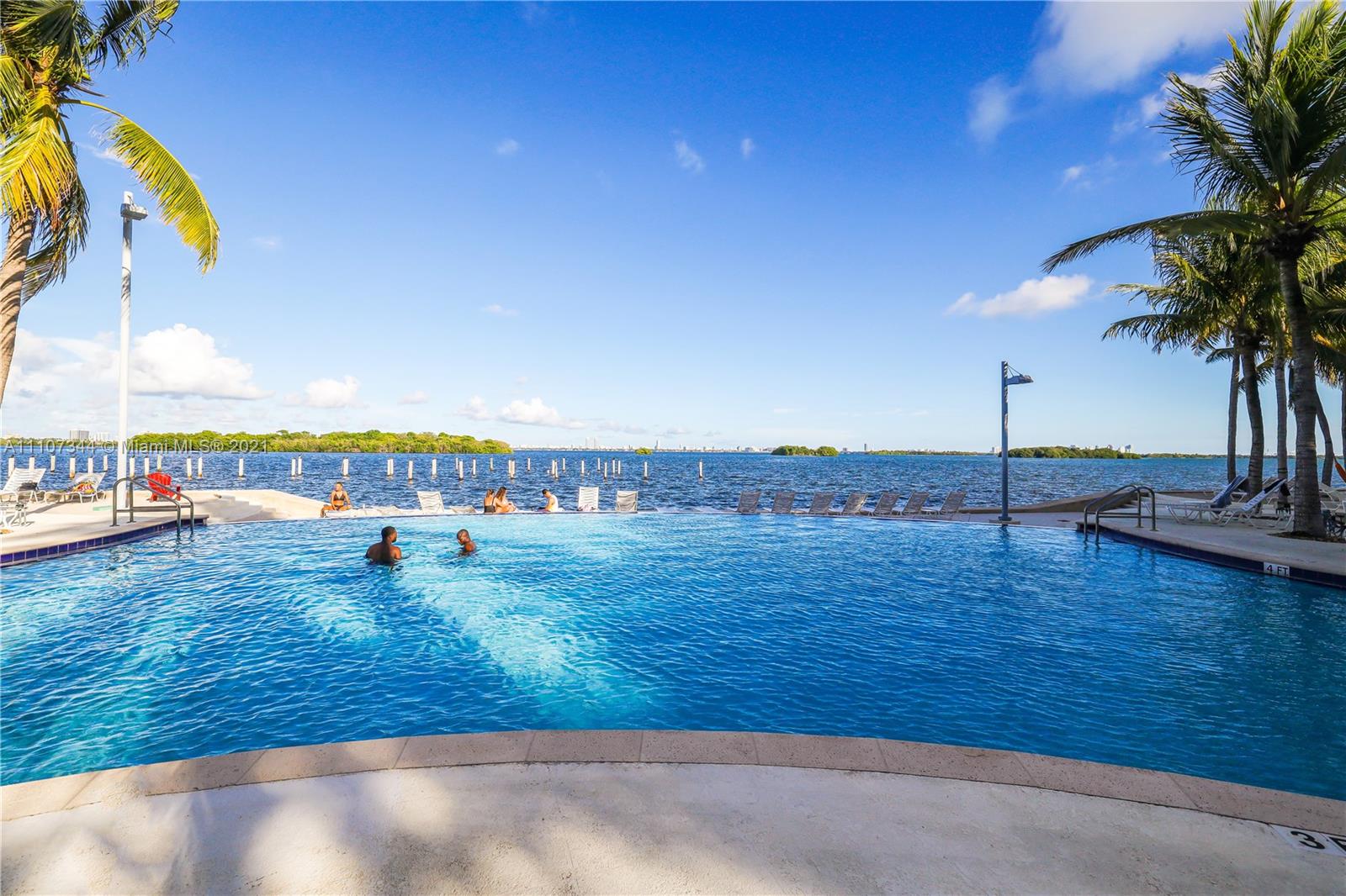 750 Northeast 64th Street, Unit B415 Miami, FL 33138 - Photo 15 of 32 a view of a swimming pool and an outdoor seating