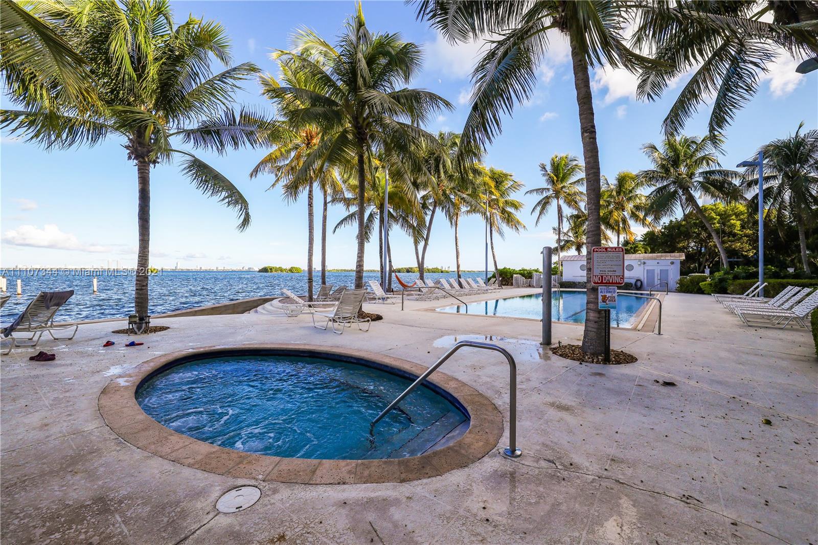 750 Northeast 64th Street, Unit B415 Miami, FL 33138 - Photo 16 of 32 a view of a swimming pool with a patio