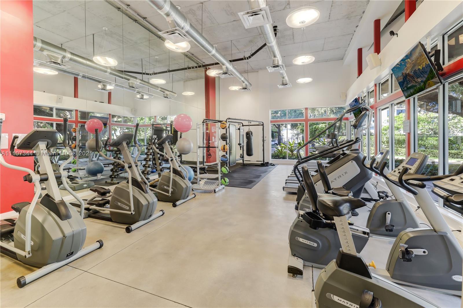 750 Northeast 64th Street, Unit B415 Miami, FL 33138 - Photo 21 of 32 a view of a room with gym equipment