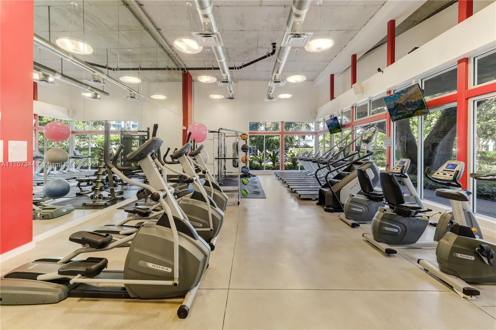 750 Northeast 64th Street, Unit B415 Miami, FL 33138 - Photo 22 of 32 a view of a room with gym equipment