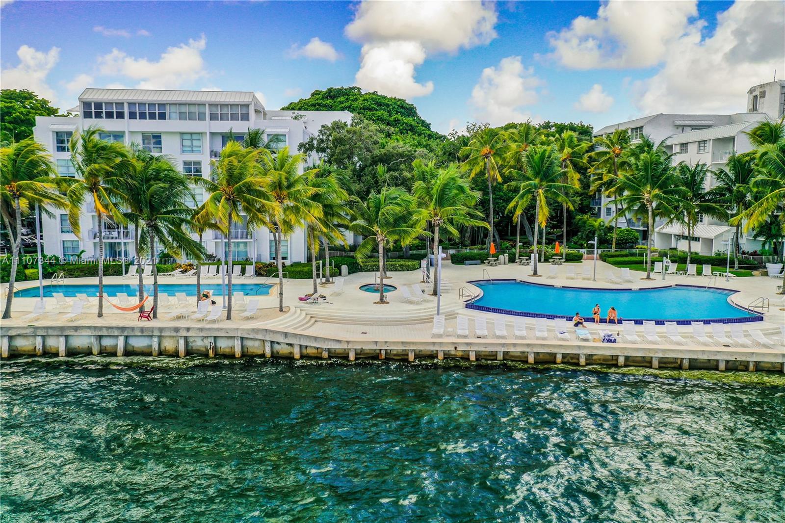 750 Northeast 64th Street, Unit B415 Miami, FL 33138 - Photo 23 of 32 a view of yard with swimming pool and green space