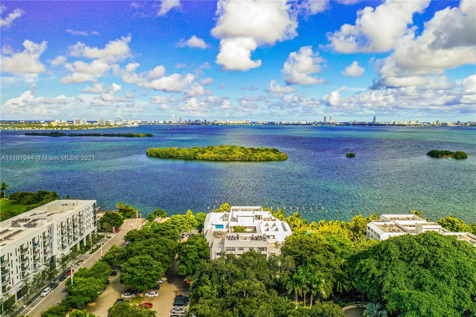 750 Northeast 64th Street, Unit B415 Miami, FL 33138 - Photo 28 of 32 a view of a lake with houses