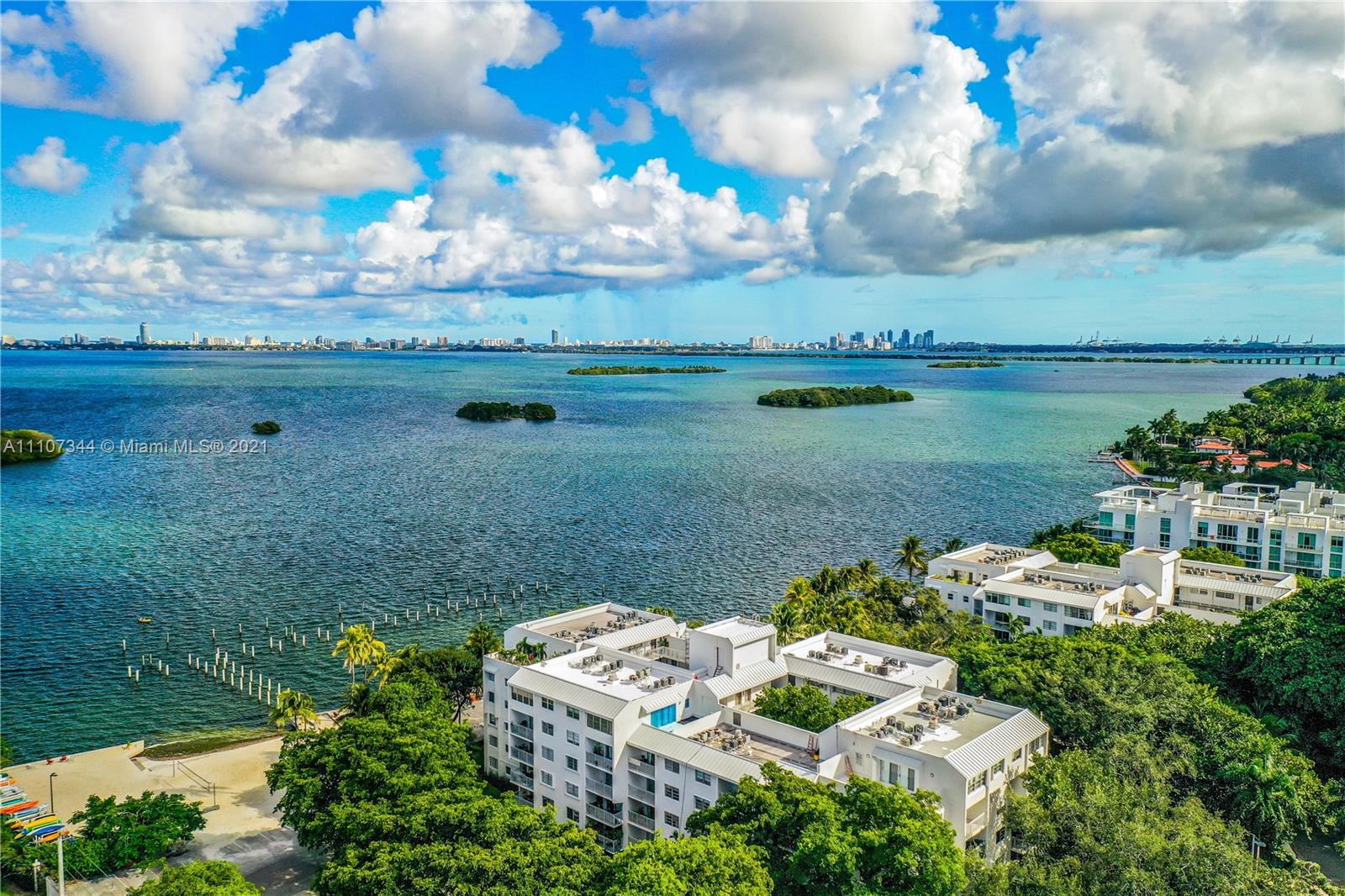 750 Northeast 64th Street, Unit B415 Miami, FL 33138 - Photo 29 of 32 a view of a lake with a yard