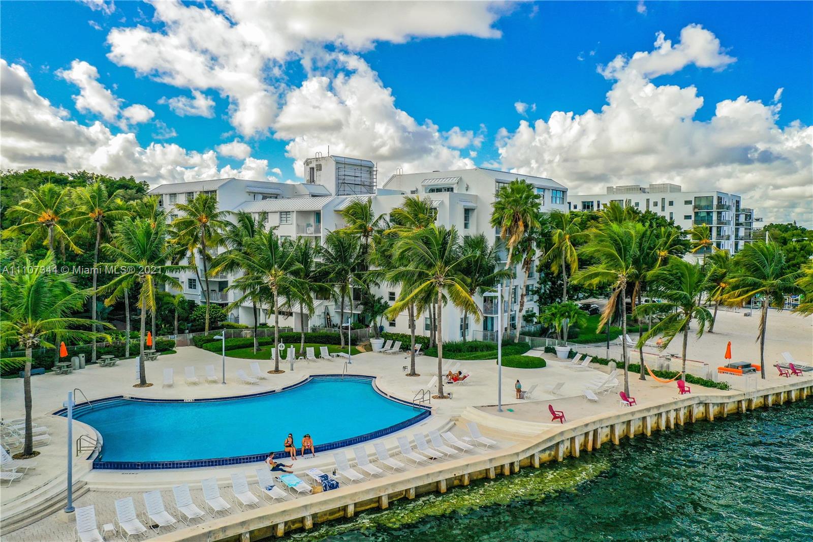 750 Northeast 64th Street, Unit B415 Miami, FL 33138 - Photo 31 of 32 a view of a swimming pool with a yard