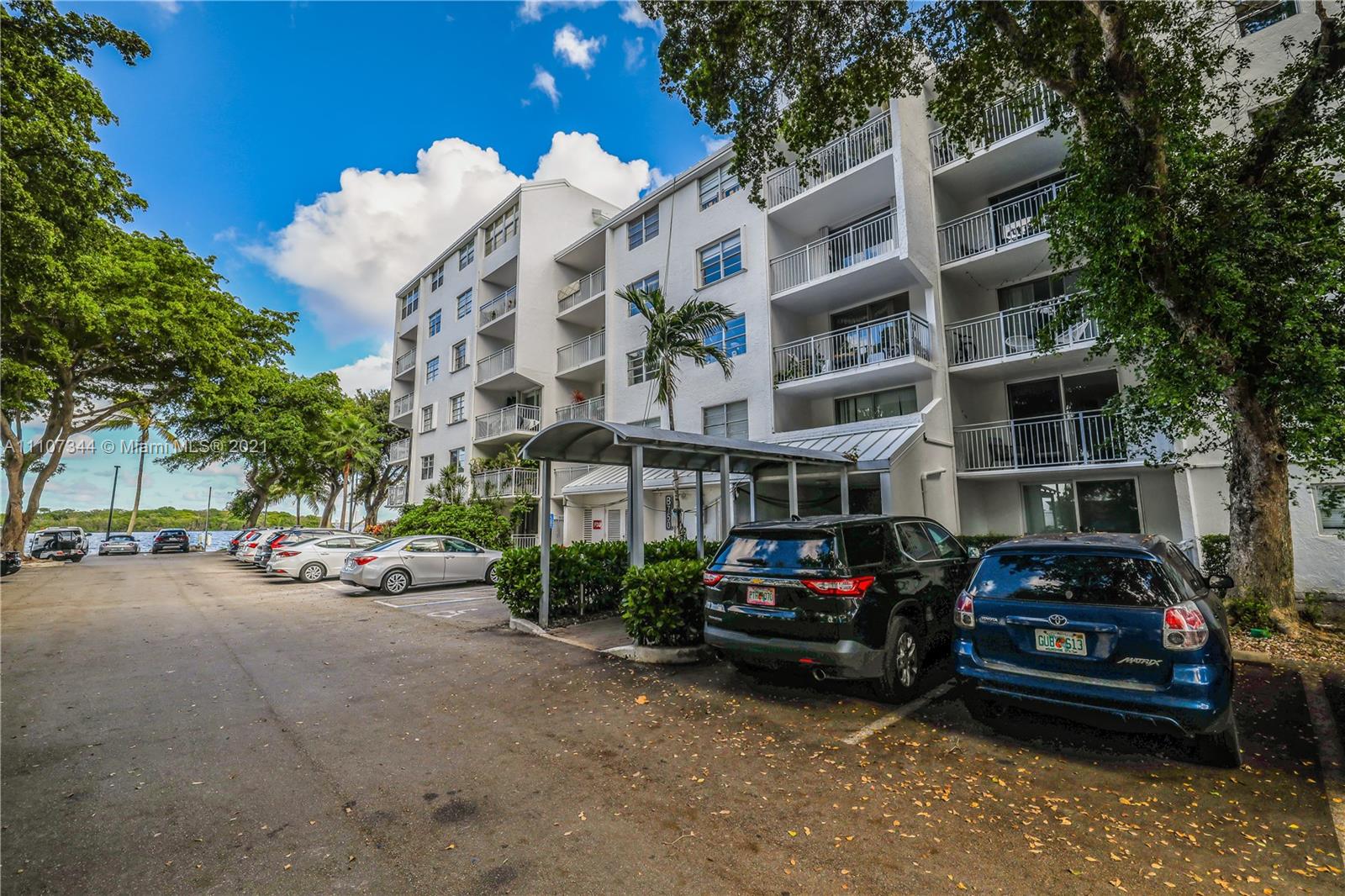 750 Northeast 64th Street, Unit B415 Miami, FL 33138 - Photo 32 of 32 a car parked in front of a building