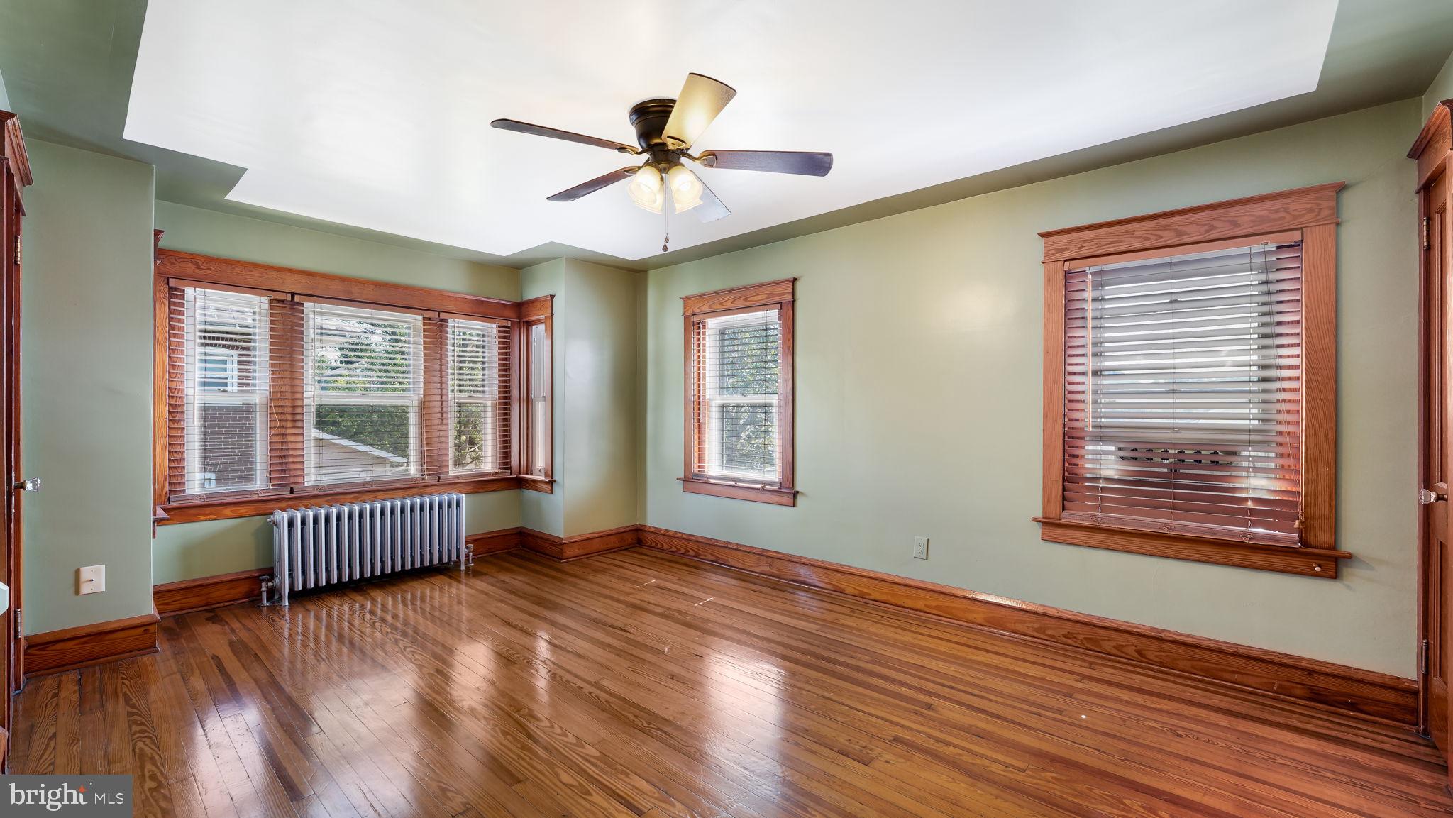 148 South Main Street Dublin, PA 18917 - Photo 12 of 21 a view of an empty room with wooden floor and a window