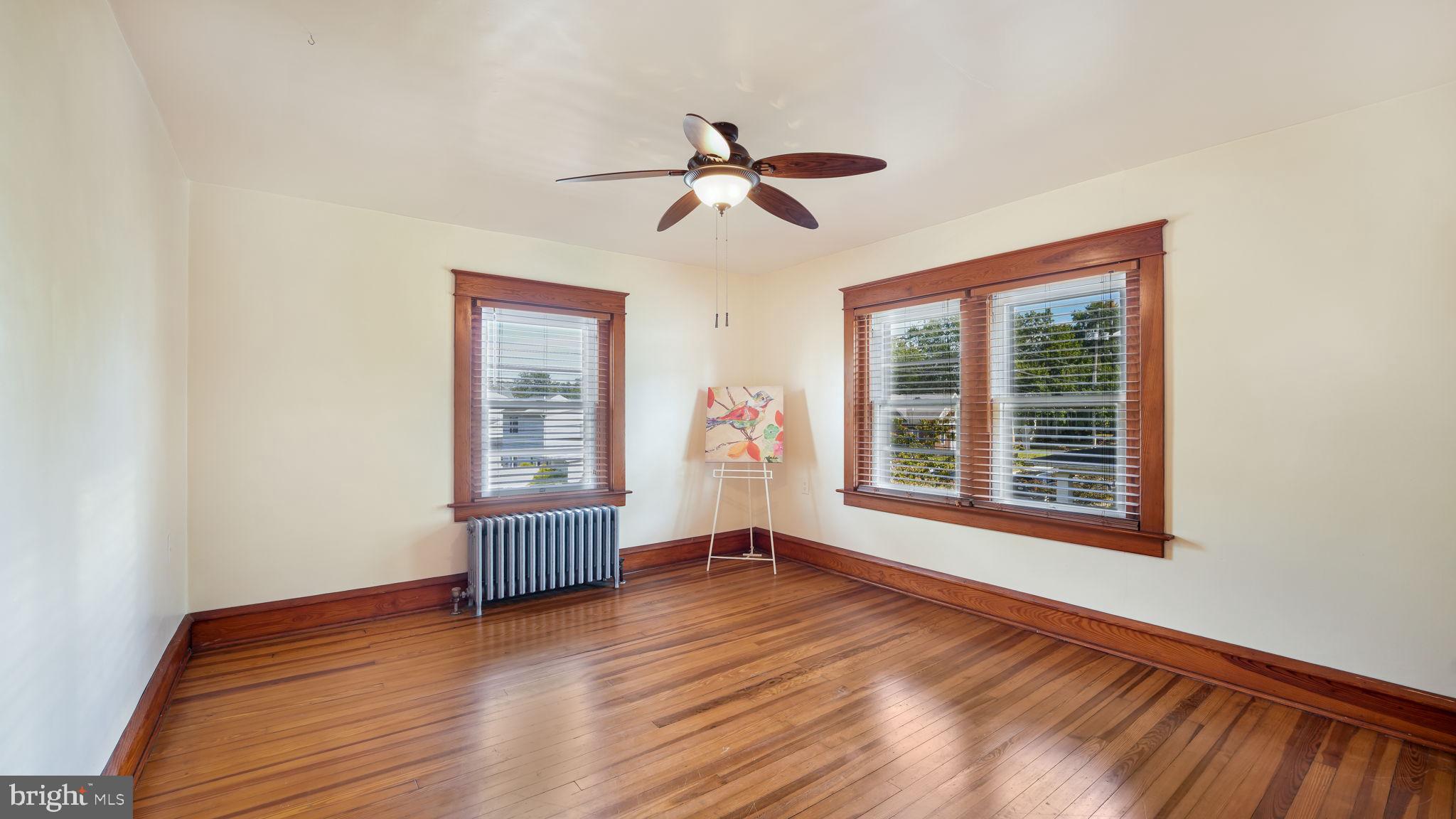 148 South Main Street Dublin, PA 18917 - Photo 13 of 21 a view of empty room with wooden floor and fan
