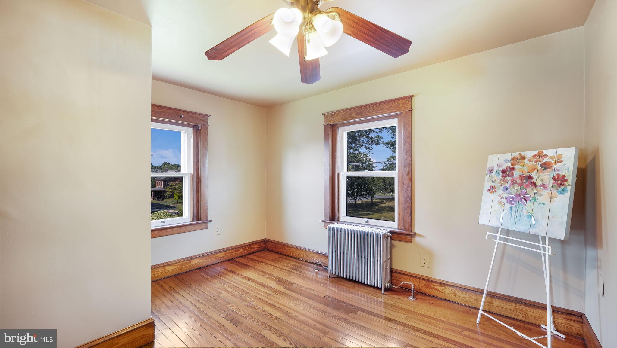 148 South Main Street Dublin, PA 18917 - Photo 14 of 21 a view of an empty room with window and wooden floor