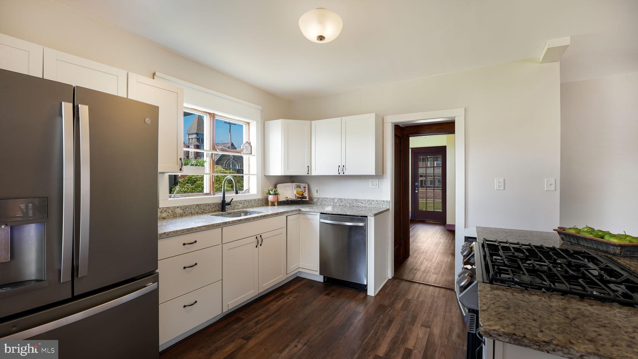 148 South Main Street Dublin, PA 18917 - Photo 4 of 21 a kitchen with granite countertop a refrigerator stove and sink
