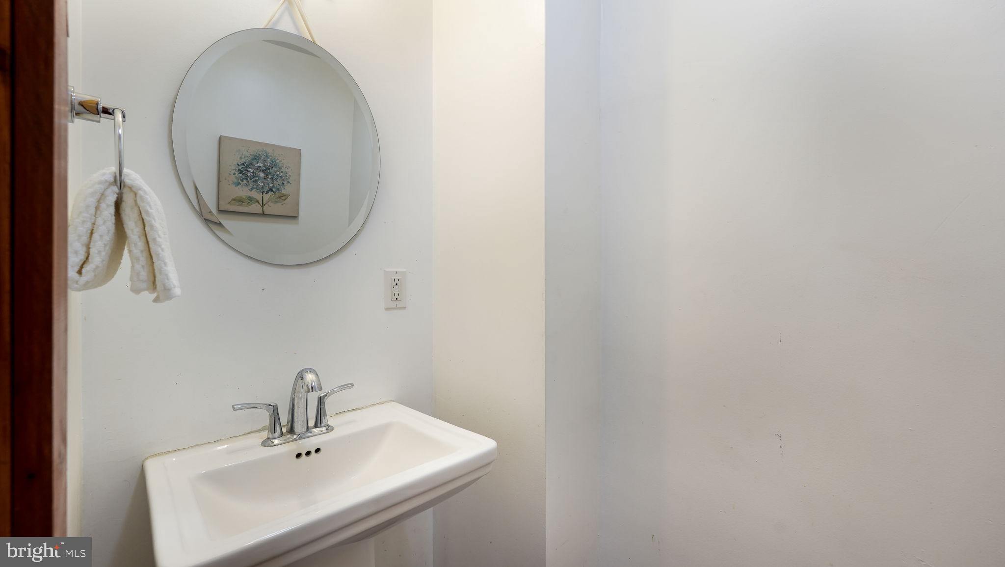 148 South Main Street Dublin, PA 18917 - Photo 10 of 21 a bathroom with a sink and a mirror