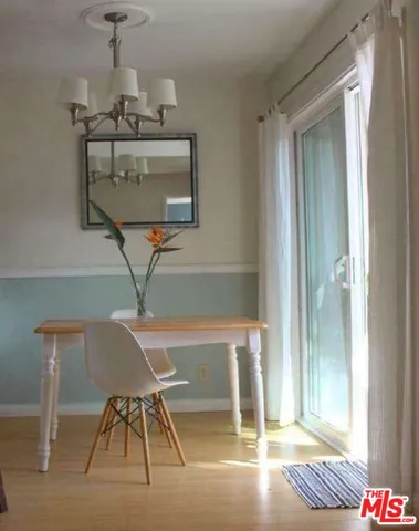 a bed room with a bed and chair