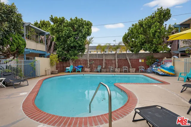 a view of a swimming pool with a patio