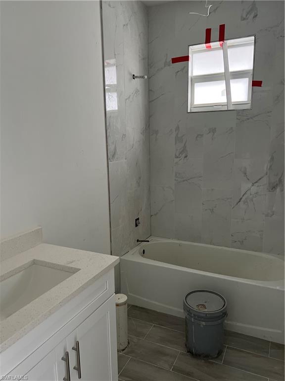 335 Ranch Avenue Lehigh Acres, FL 33974 - Photo 15 of 24 a bathroom with a sink a toilet and shower