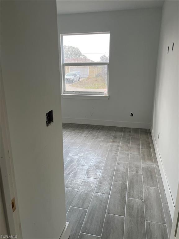 335 Ranch Avenue Lehigh Acres, FL 33974 - Photo 16 of 24 an empty room with a window