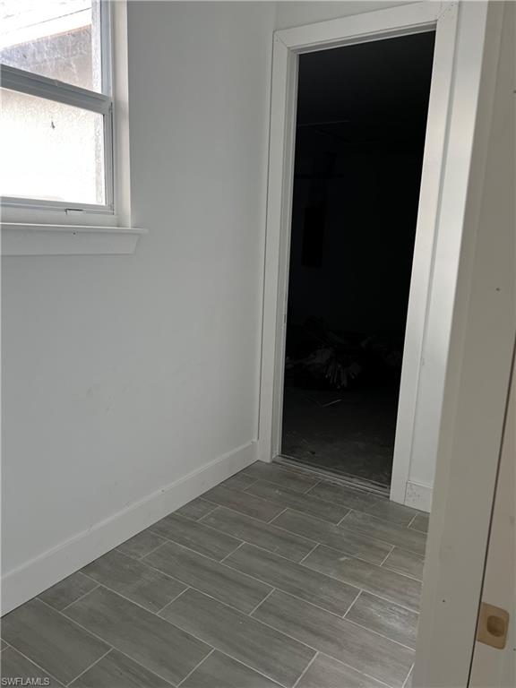 335 Ranch Avenue Lehigh Acres, FL 33974 - Photo 19 of 24 a view of an empty room with a window